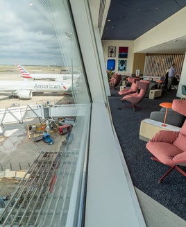 Chairs overlooking the tarmac from the Capital One lounge at DFW airport