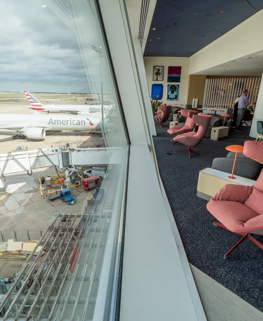 Chairs overlooking the tarmac from the Capital One lounge at DFW airport