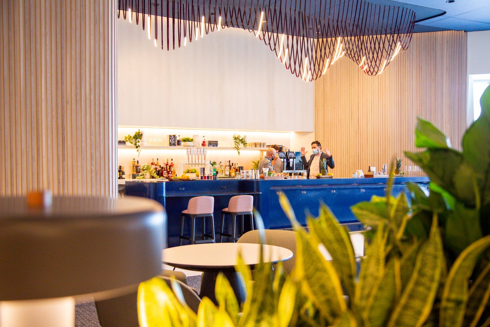 seating and bar area at the Capital One Lounge in the Dallas-Fort Worth airport