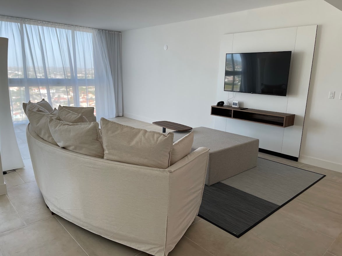 Couch and TV in Radisson Blu Aruba Suite