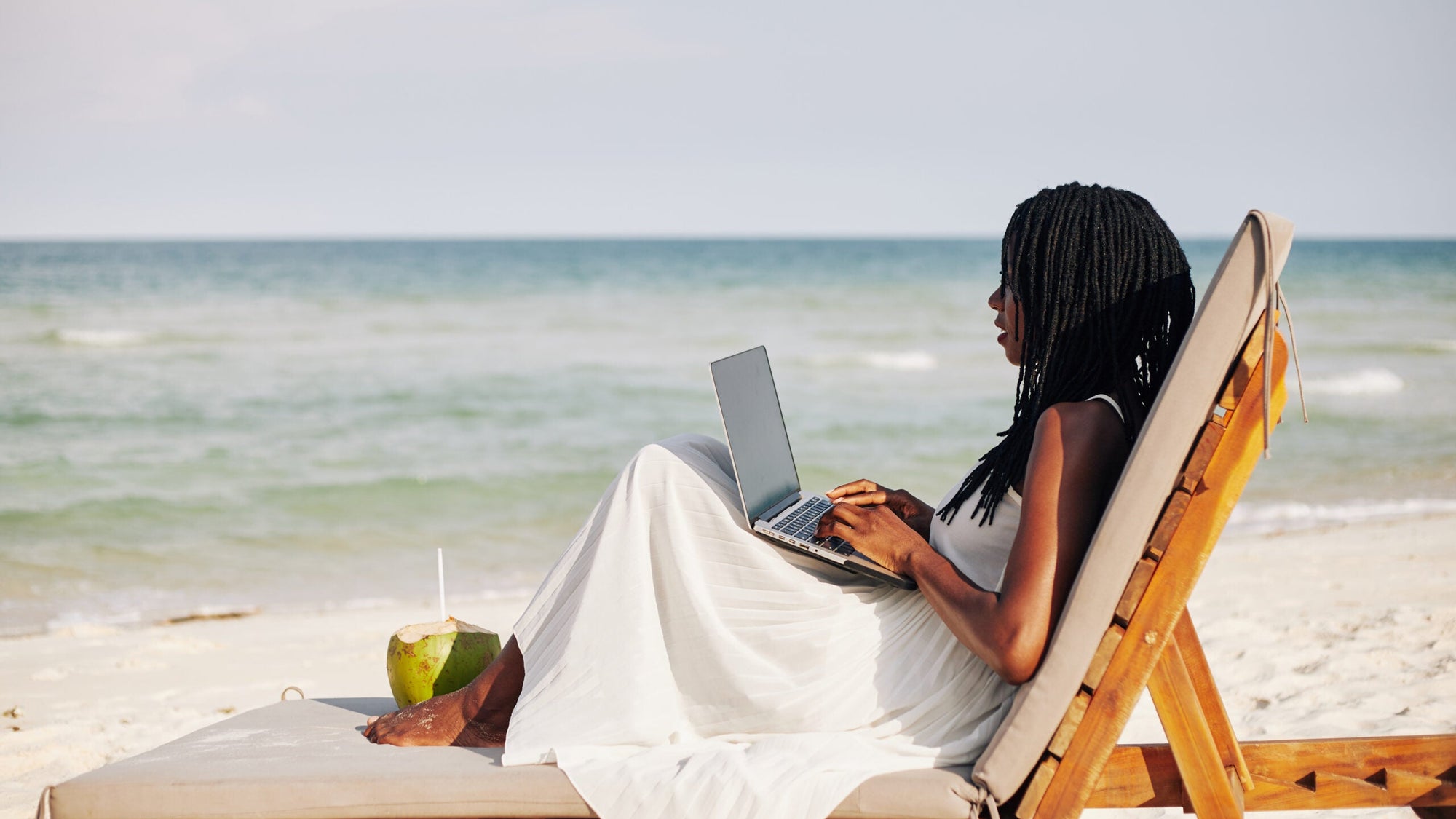 Female freelancer on beach