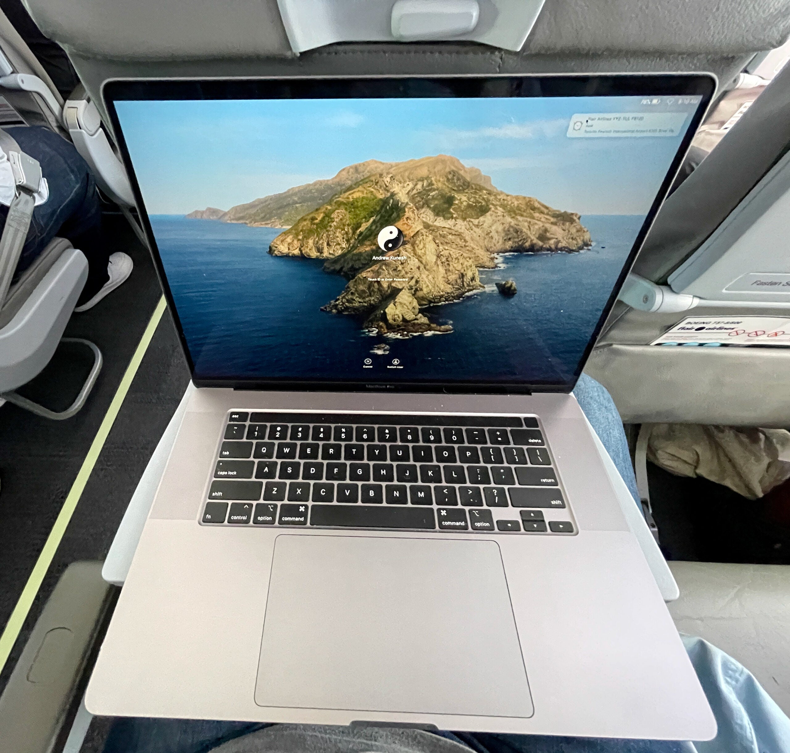 MacBook Pro on Flair Airlines tray table