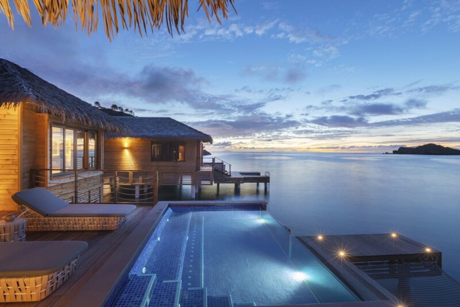 overwater bungalow during sunset