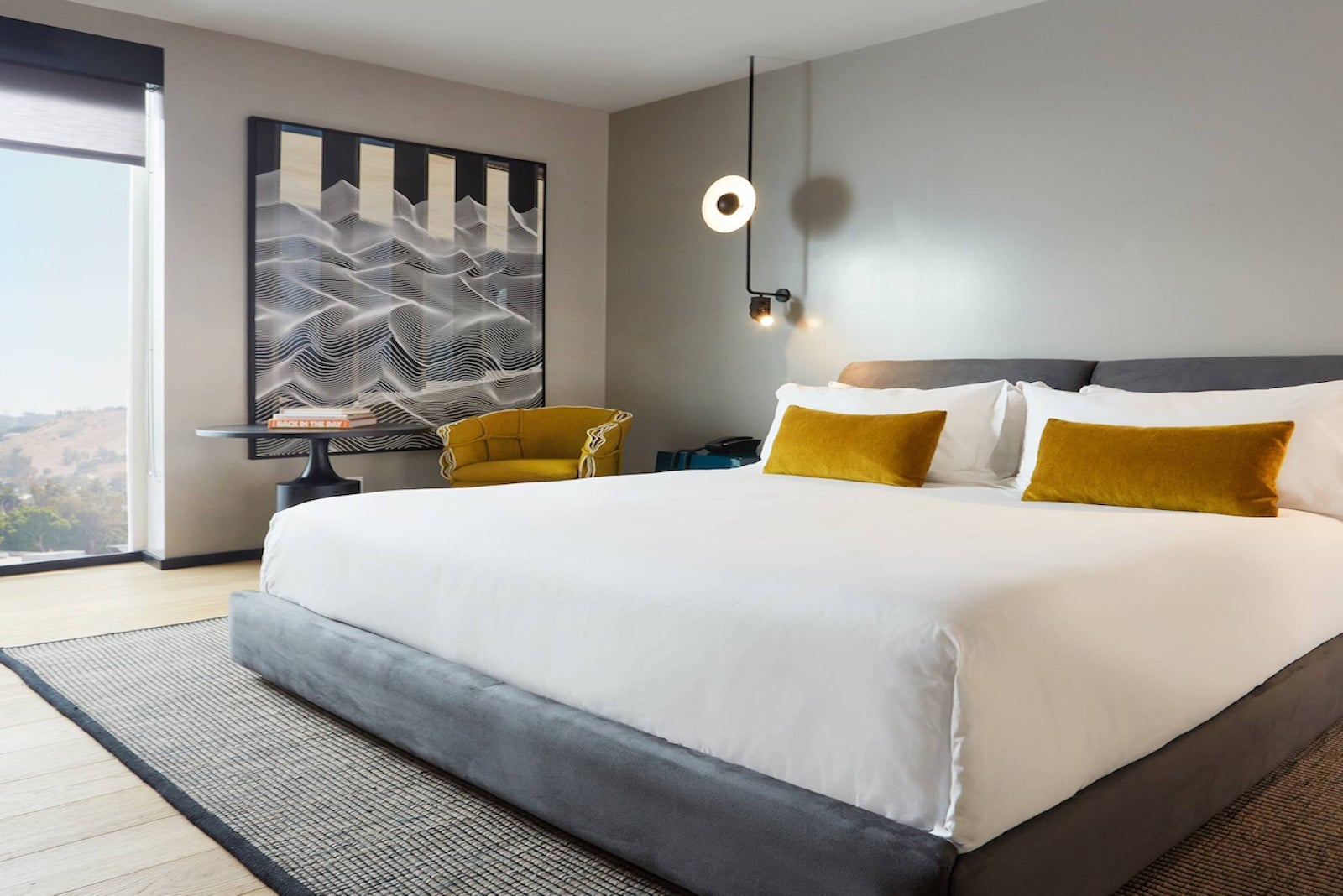 large king-sized bed in grey hotel room