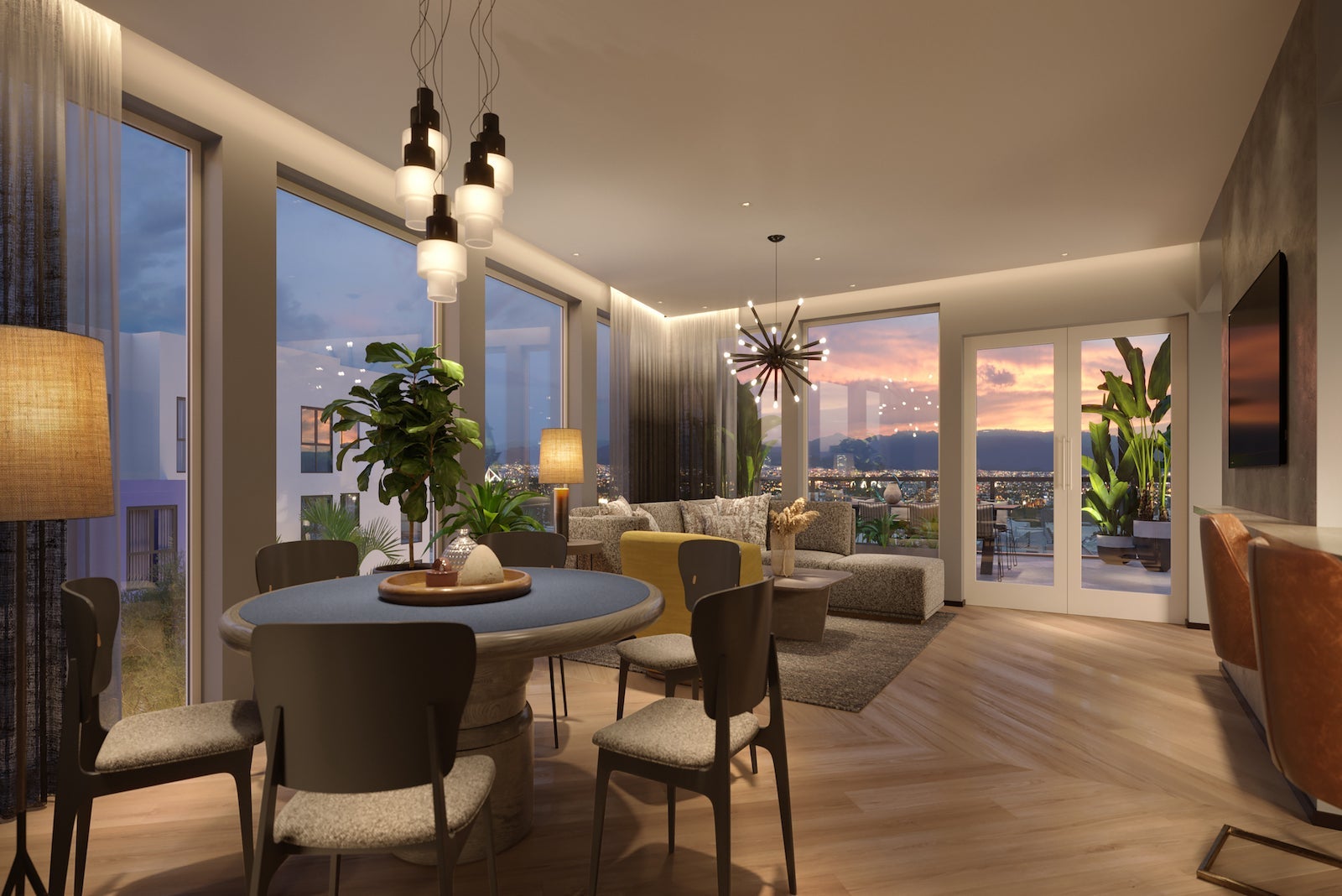 large suite with dining table, living room and views of the LA mountains