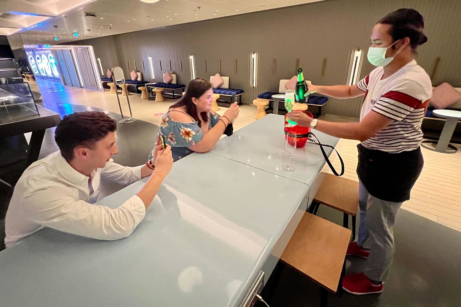 Virgin Voyages Champagne being poured on board