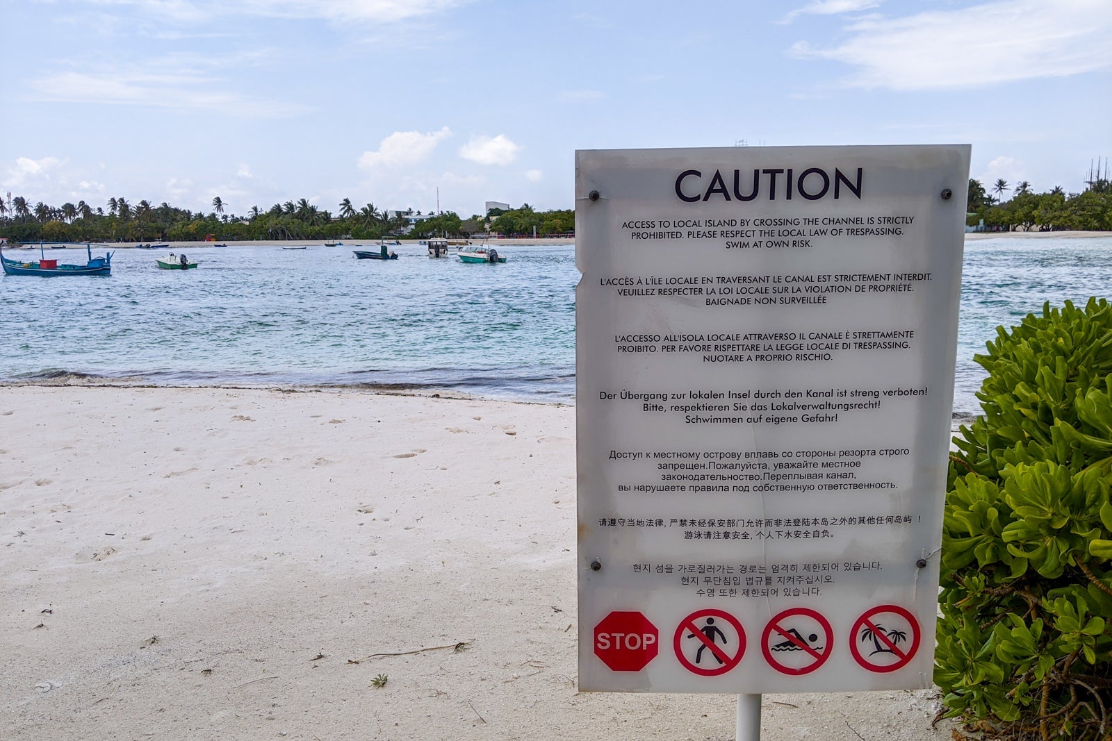 Signs about crossing to Guraidhoo