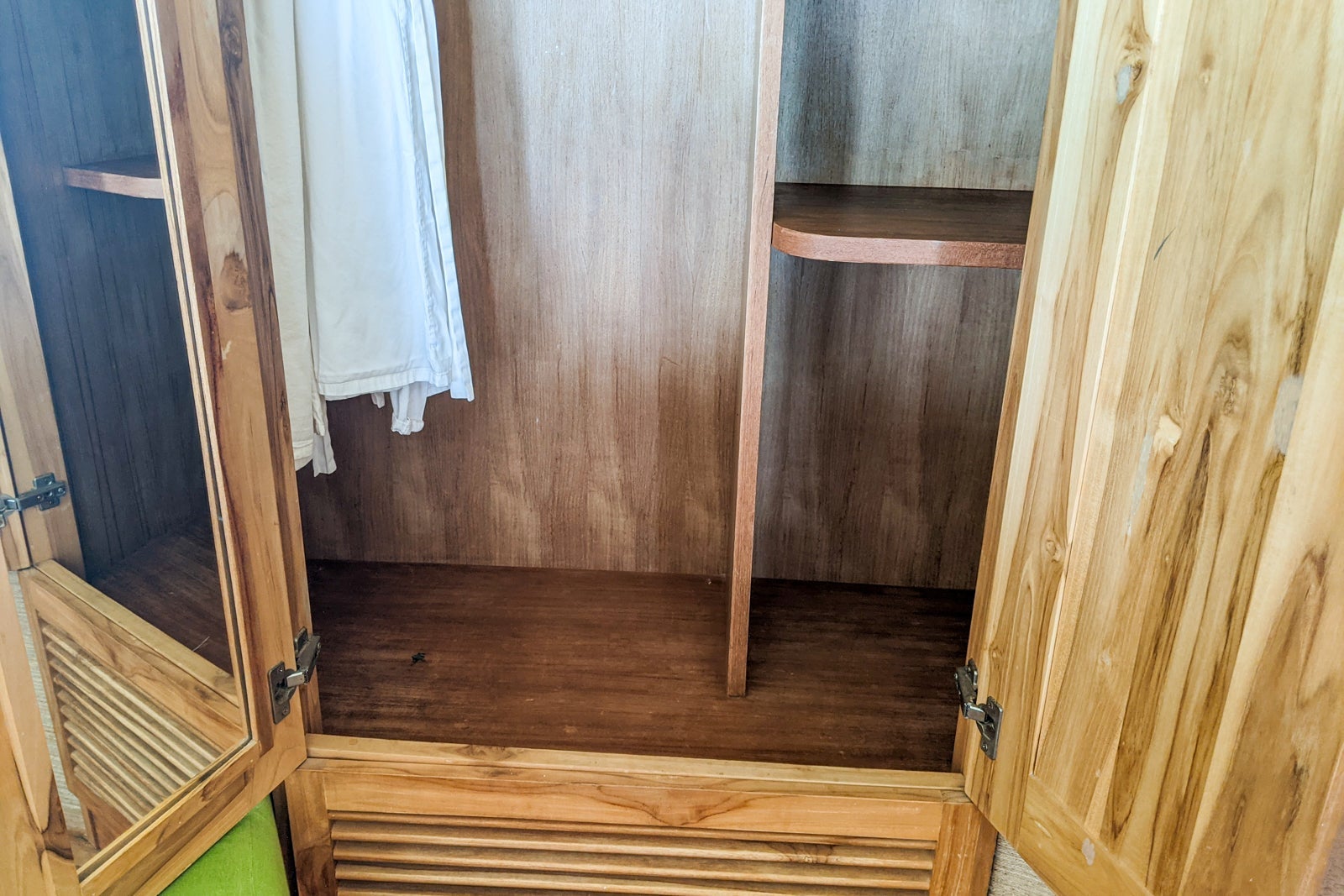 Closet to the left of the toilet room