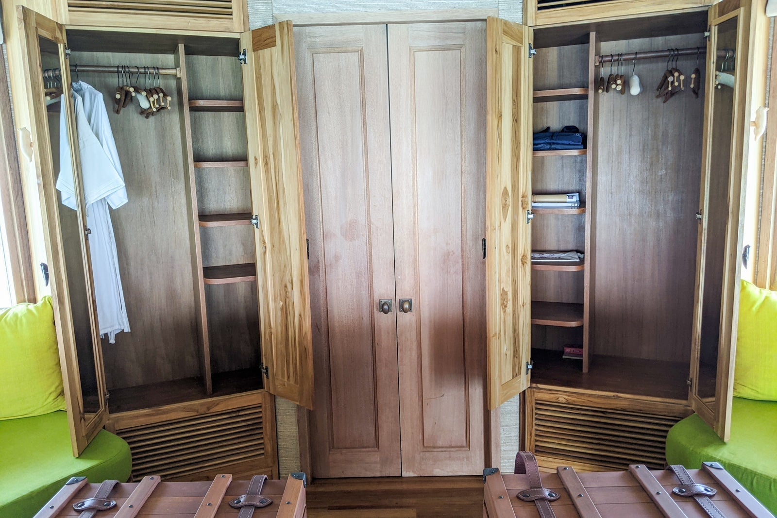 Doors to the toilet room between two closets