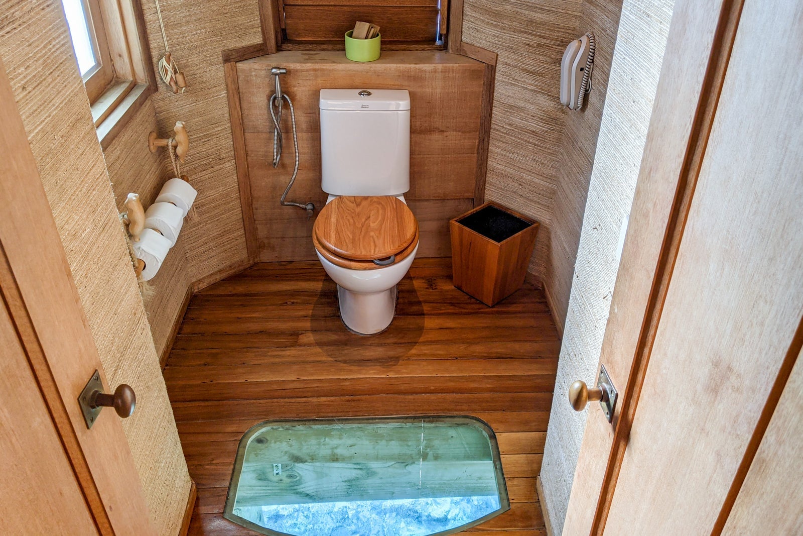 View of the water below from the water villa toilet