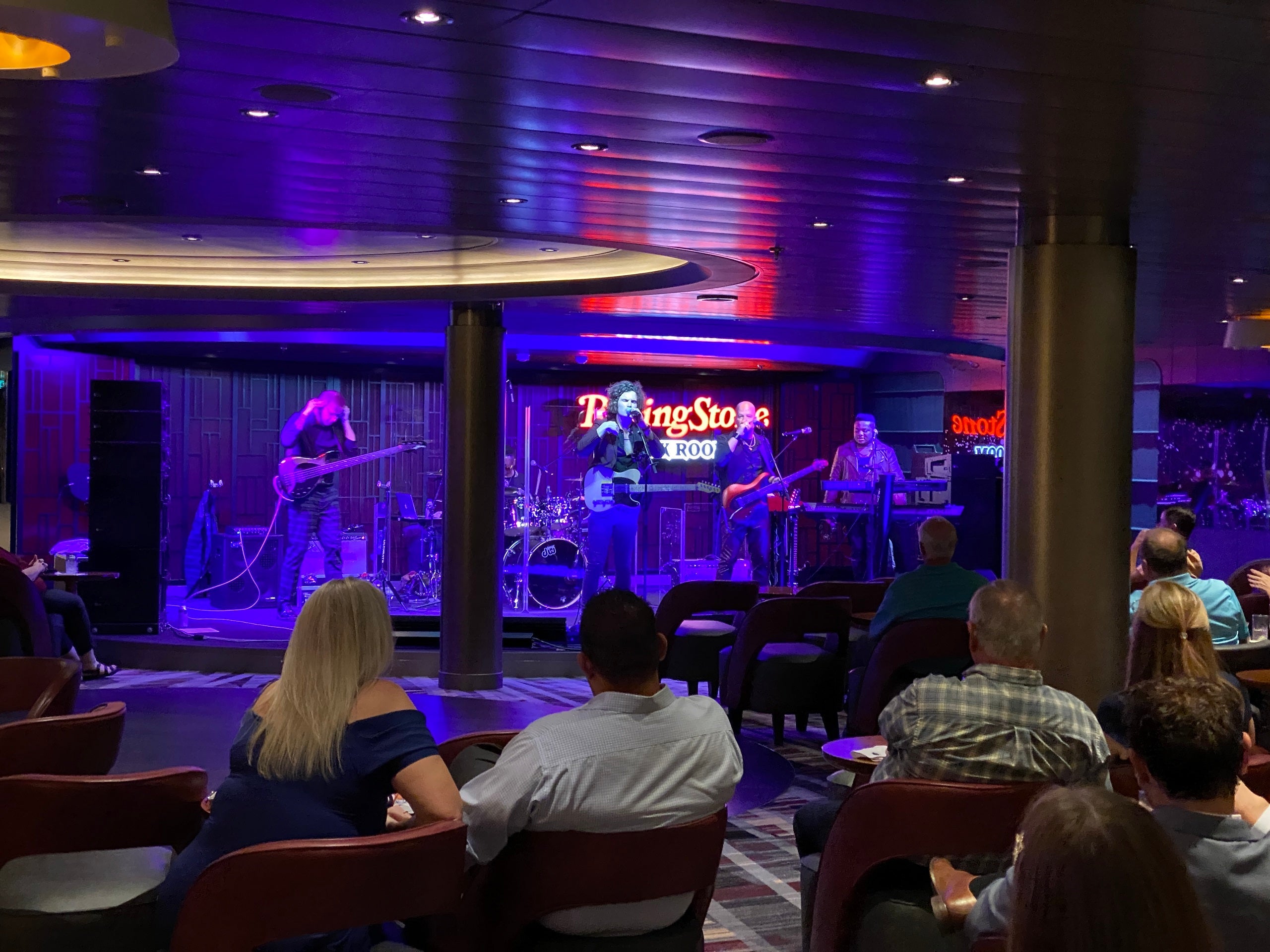Cruisers watch a performance at the Rolling Stone Rock Room, a live music venue on Holland America's Rotterdam