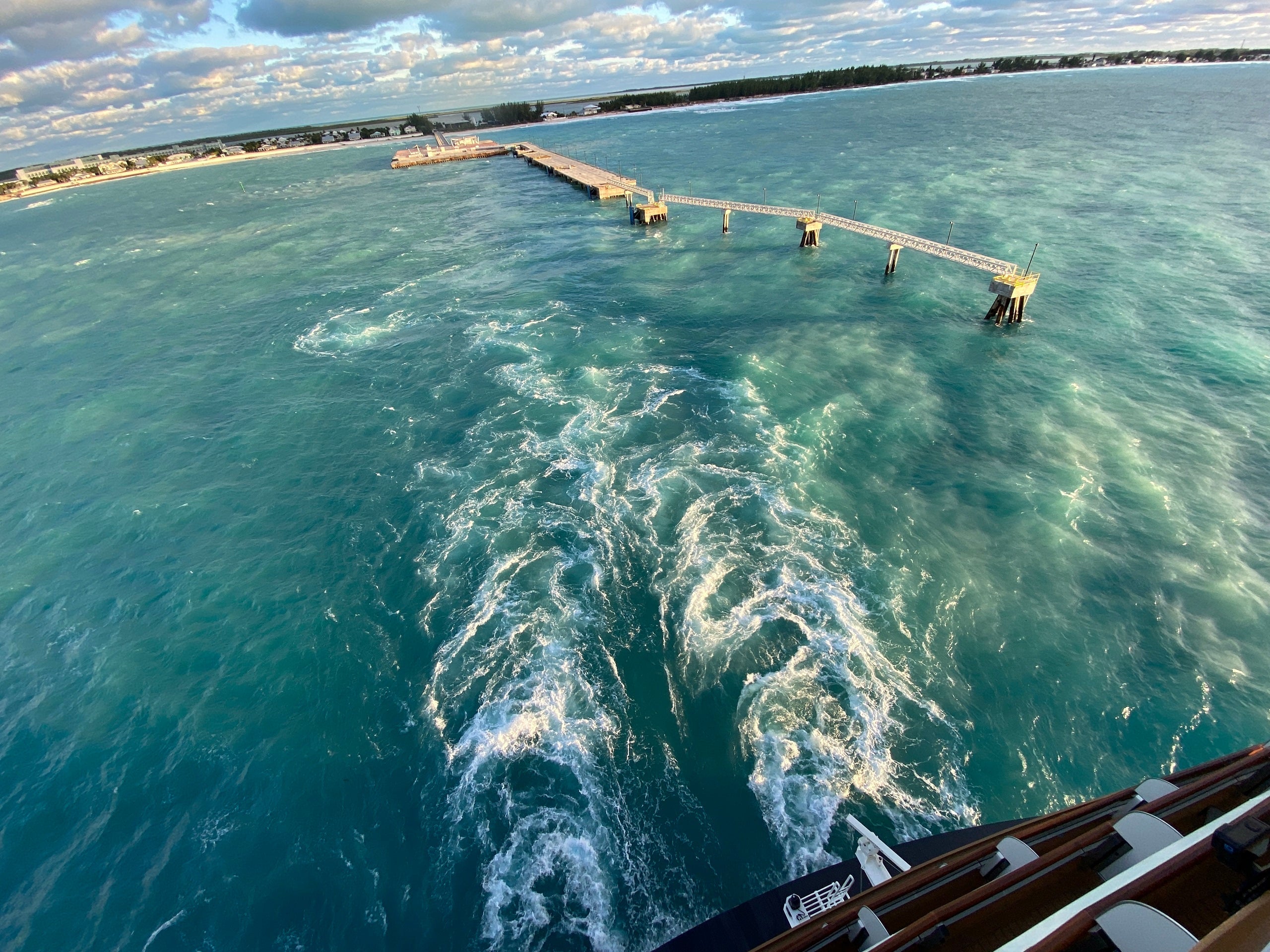 A cruise ship's wake as it sails away from the dock at Bimini in the Bahamas