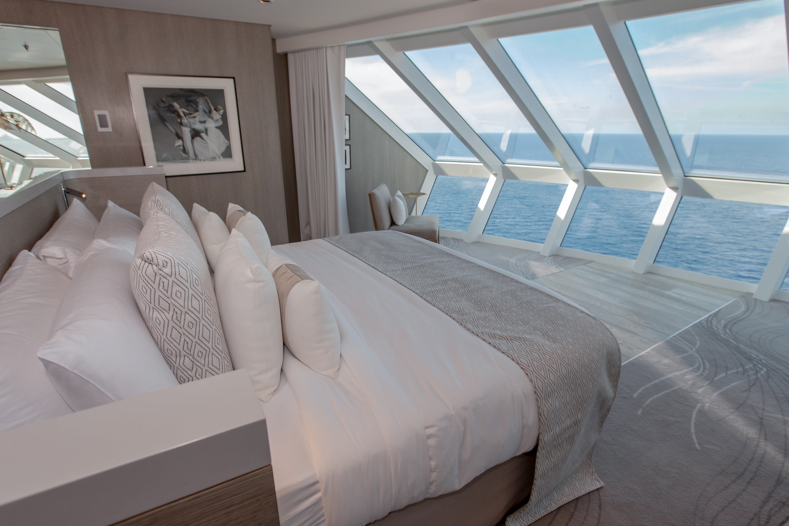 Iconic Suites on Edge Class ships have bedrooms with beds facing windows looking out over the bow. The views, as you might expect, are stunning