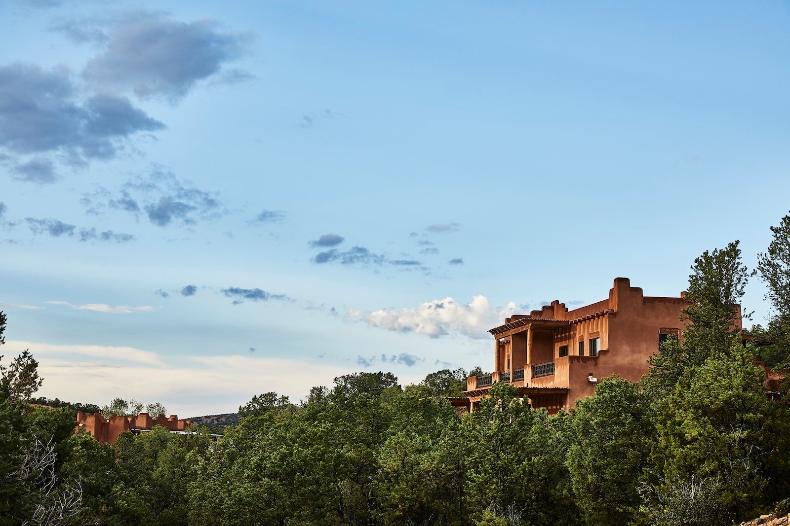 adobe building with sky and trees