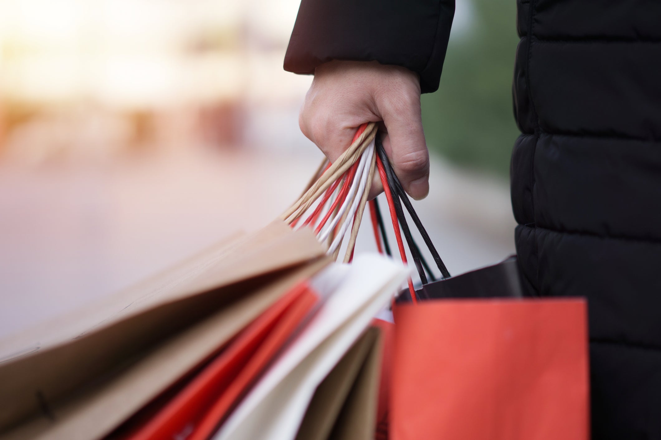 Person holding shopping bags