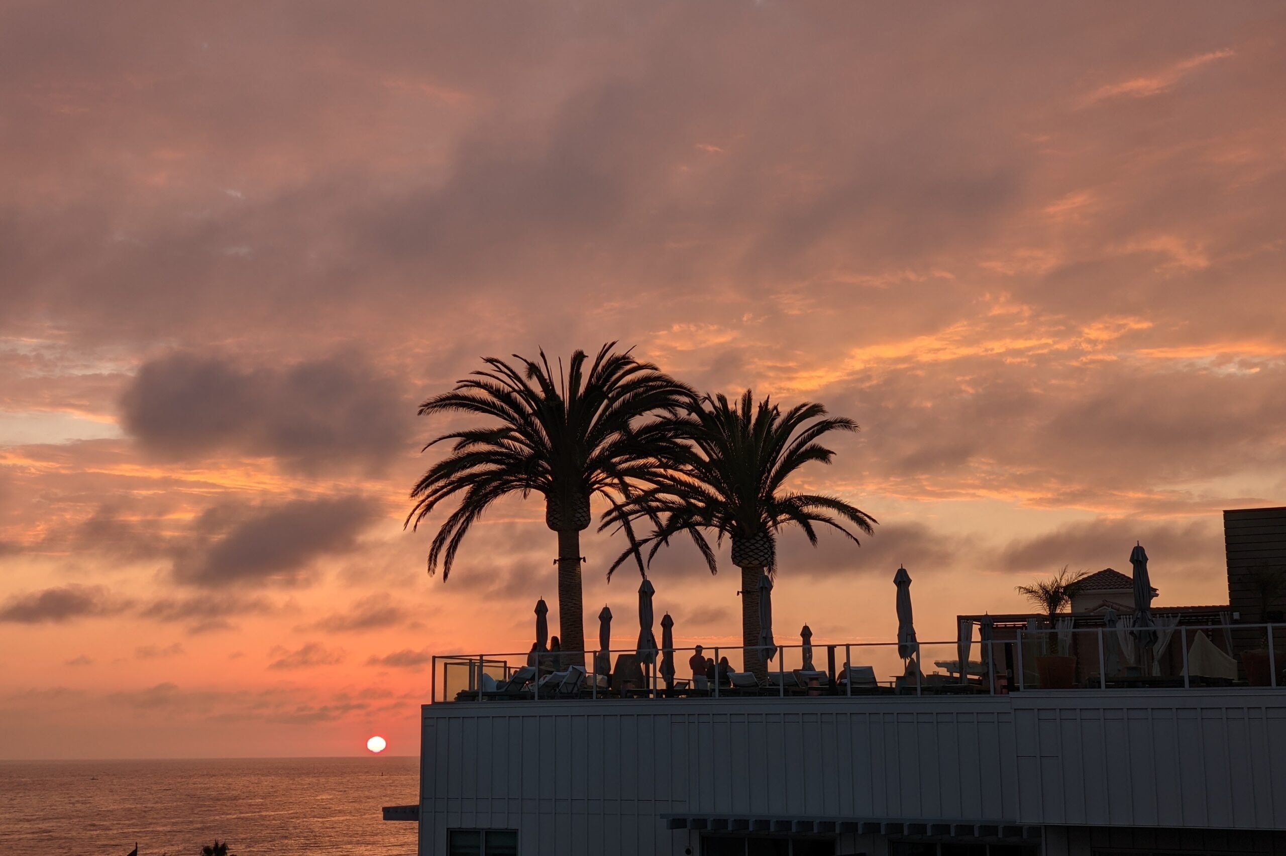 The sun sets over the Pacific Ocean from the Mission Pacific Hotel in Oceanside, California