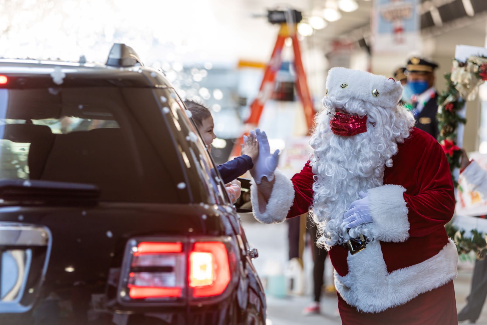 Santa high fives at United.