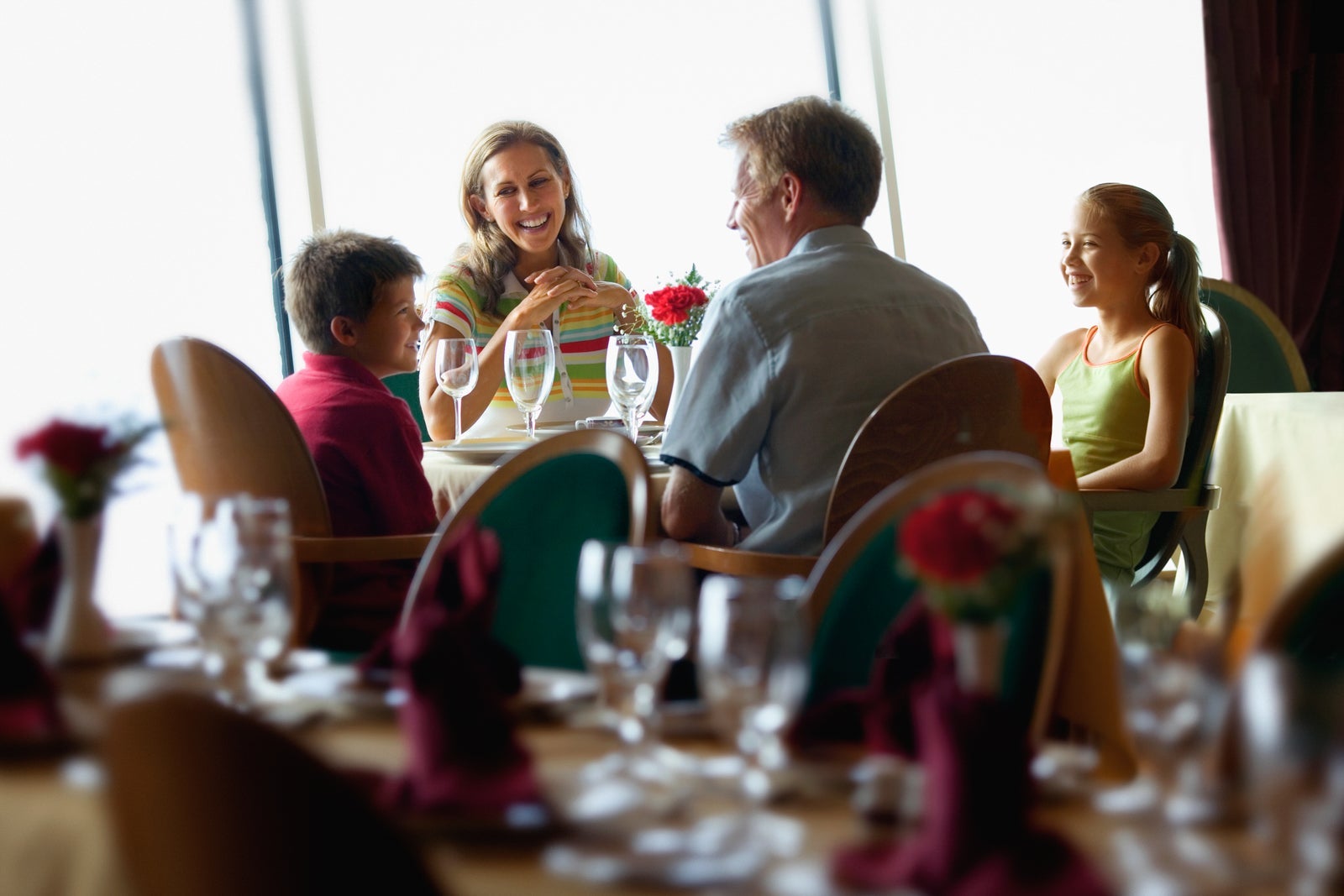 Family eating a casual meal on a cruise ship