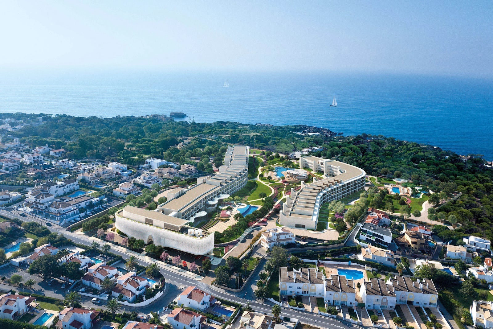 aerial rendering of large hotel near ocean
