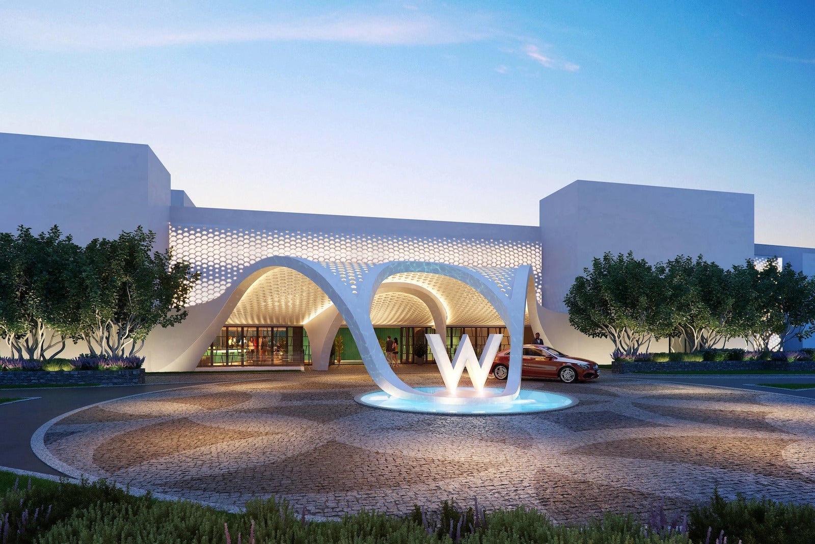 large white hotel with W sign in fountain