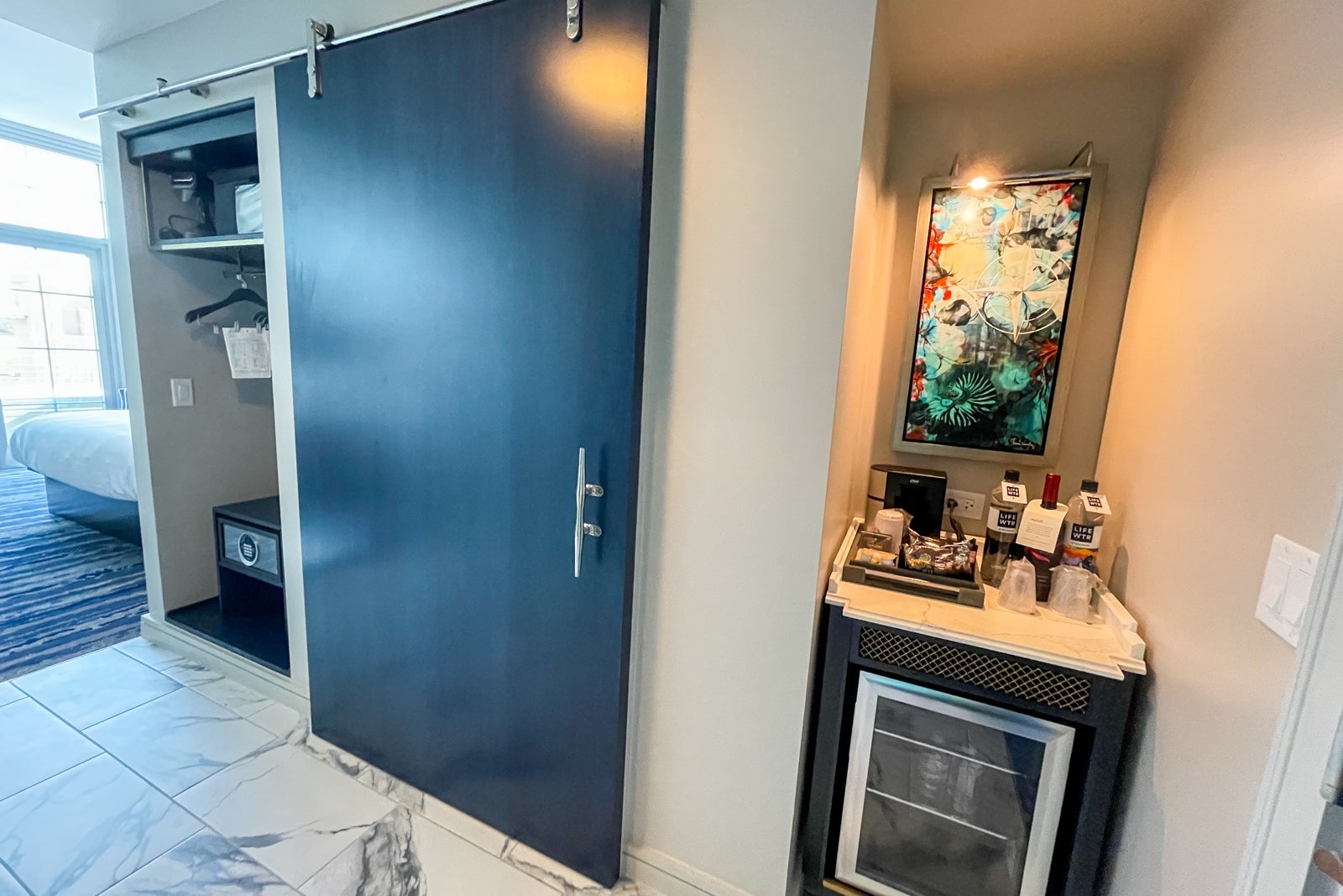 Bathroom door and wet bar of king balcony room at the JW Marriott Savannah Plant Riverside