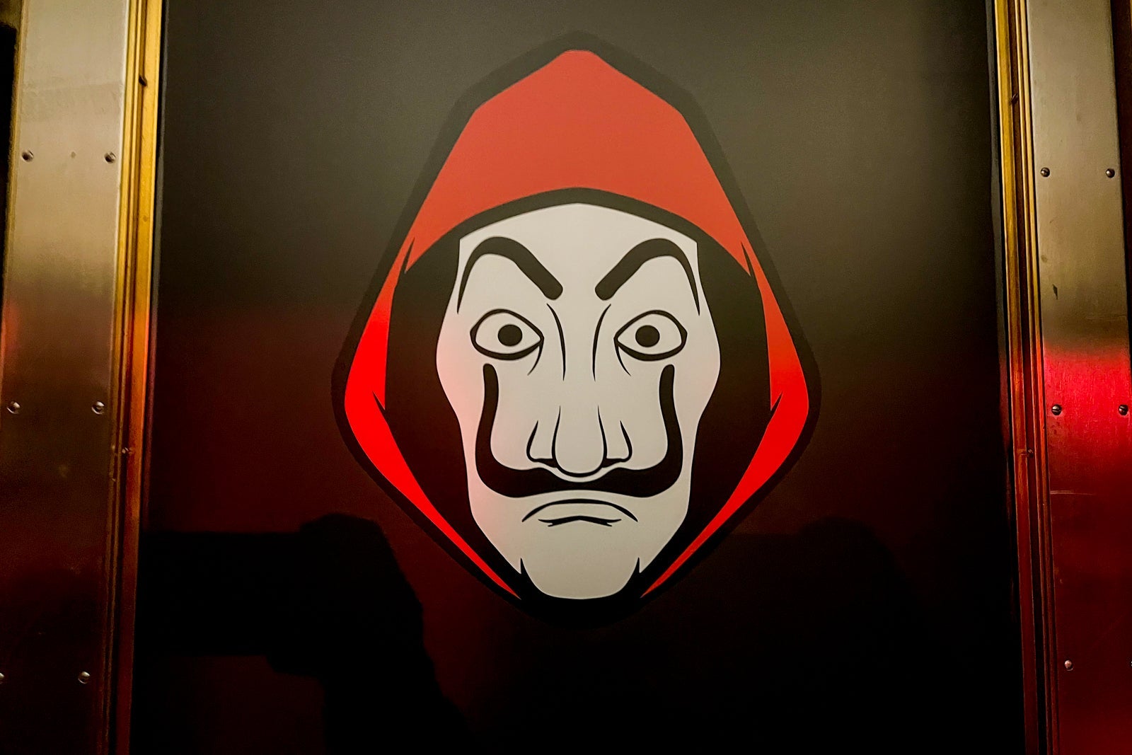 Money Heist show logo on a door