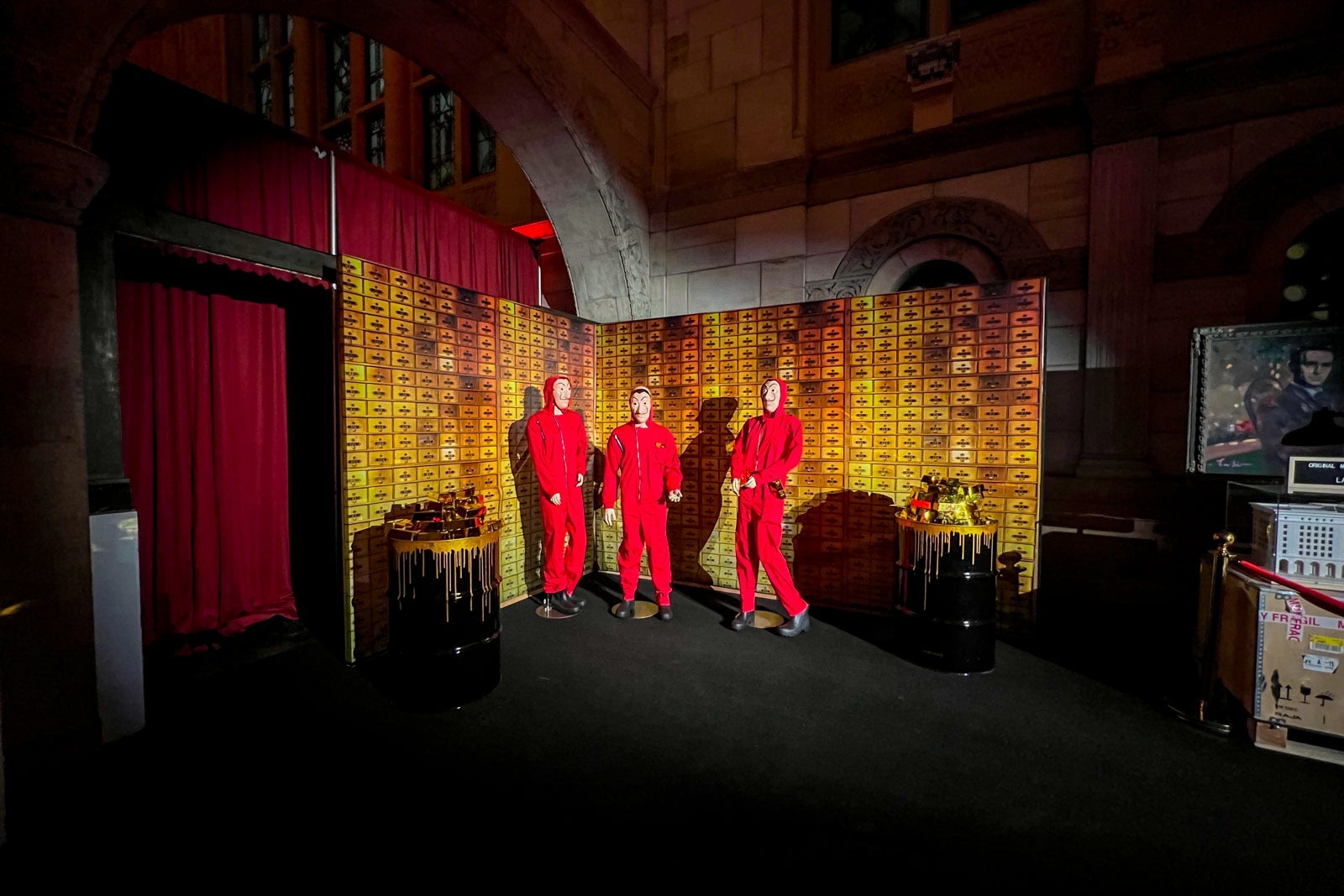 Red jumpsuit mannequins in the photo area of the Money Heist experience in NYC