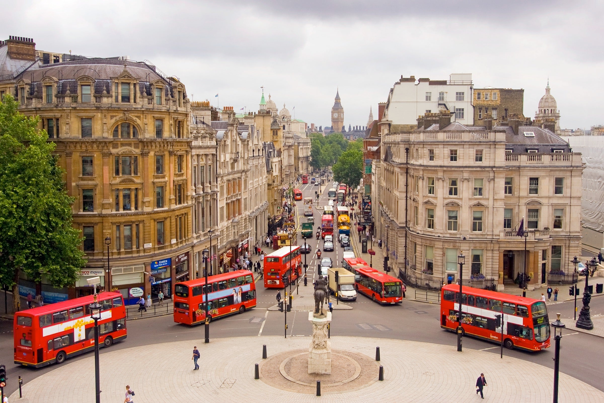 Buses in London with Big Ben in the background