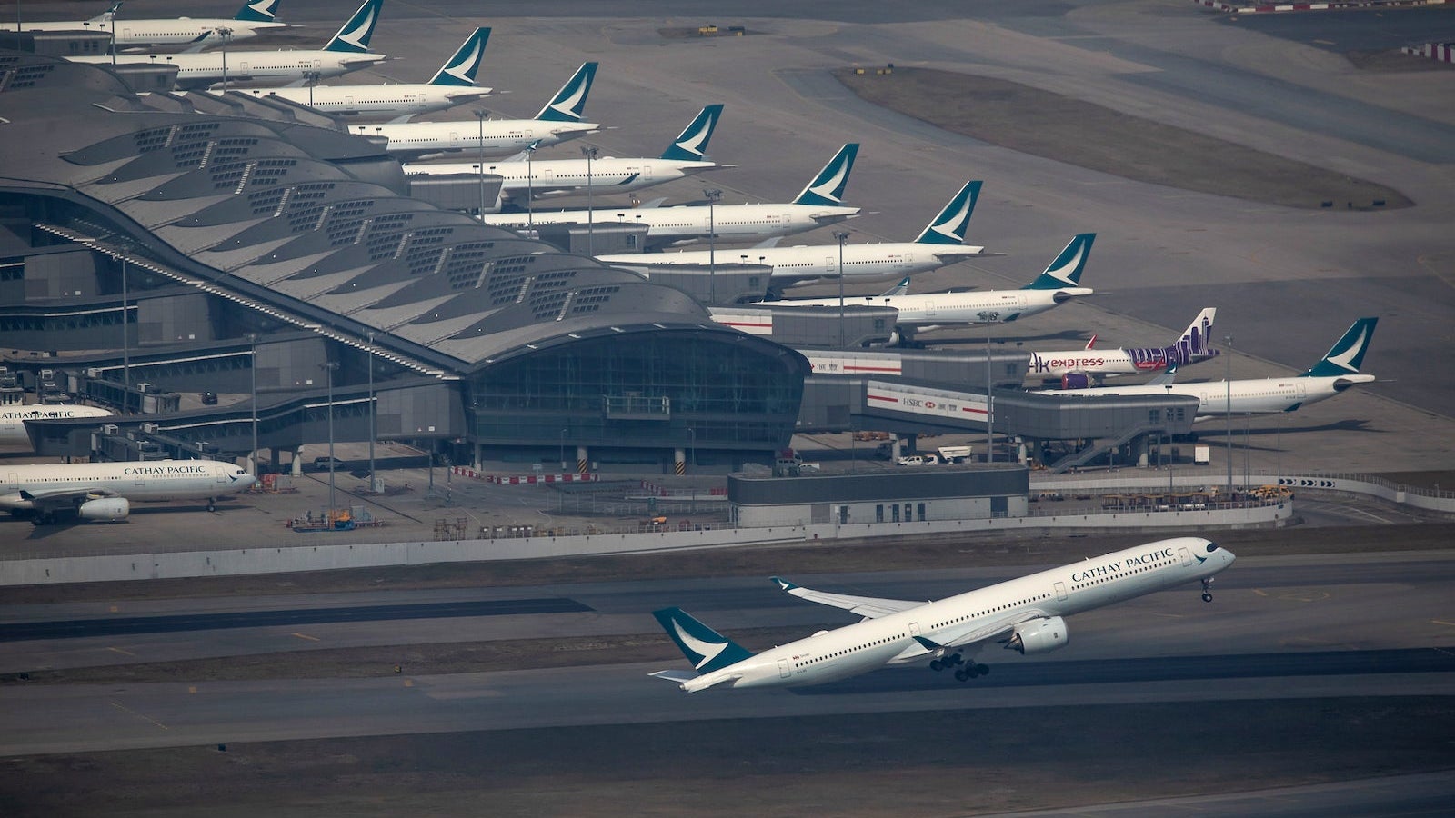 Aircraft at Hong Kong International Airport As Hong Kong Scraps Flights Amid Omicron