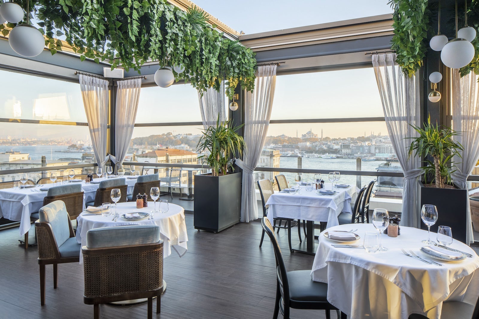 restaurant with tables in partial open roofed restaurant