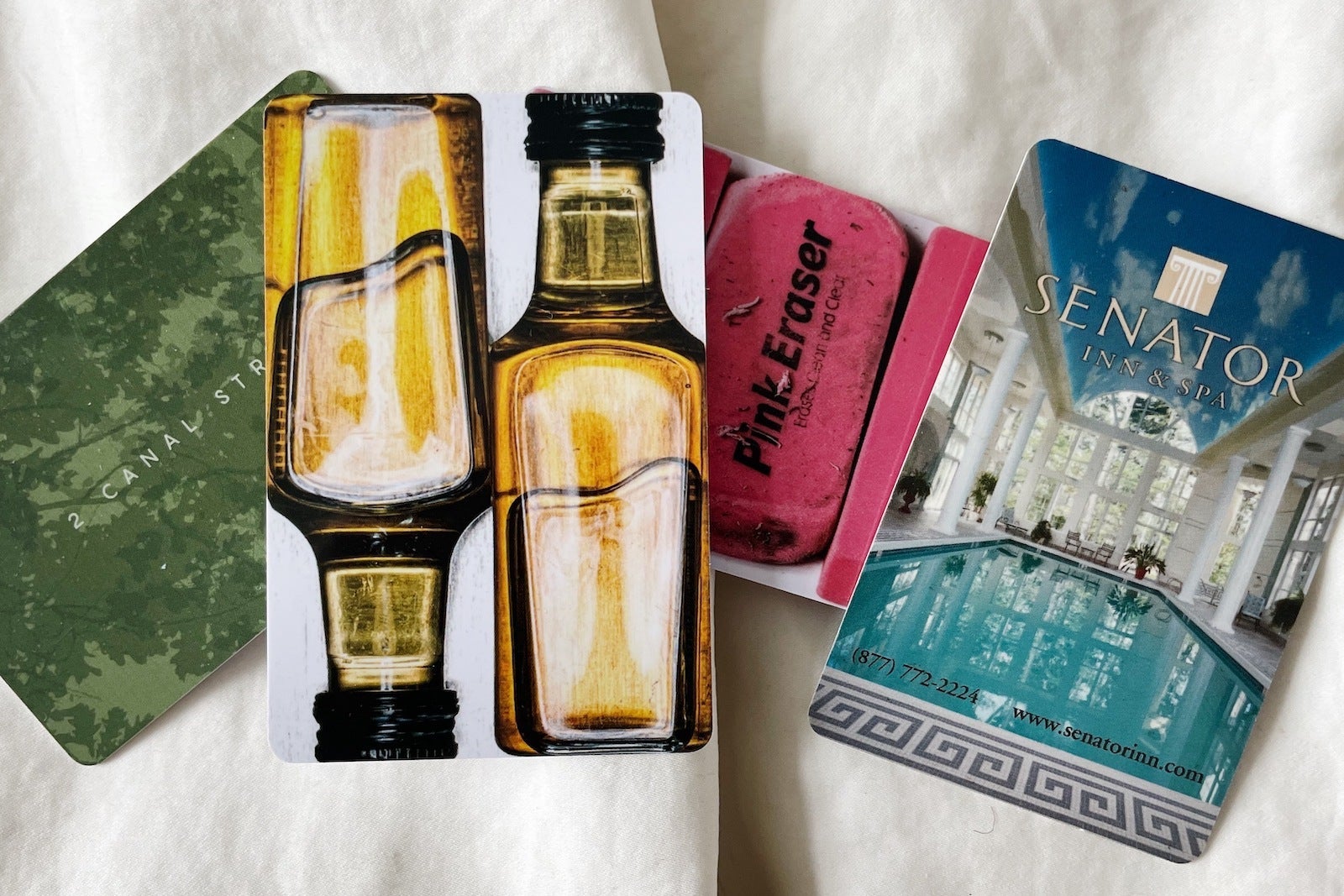 hotel key cards on bed