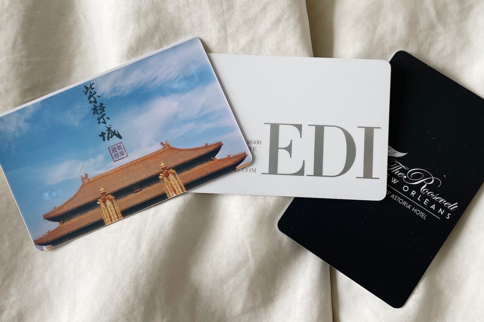 Hotel key cards on bed