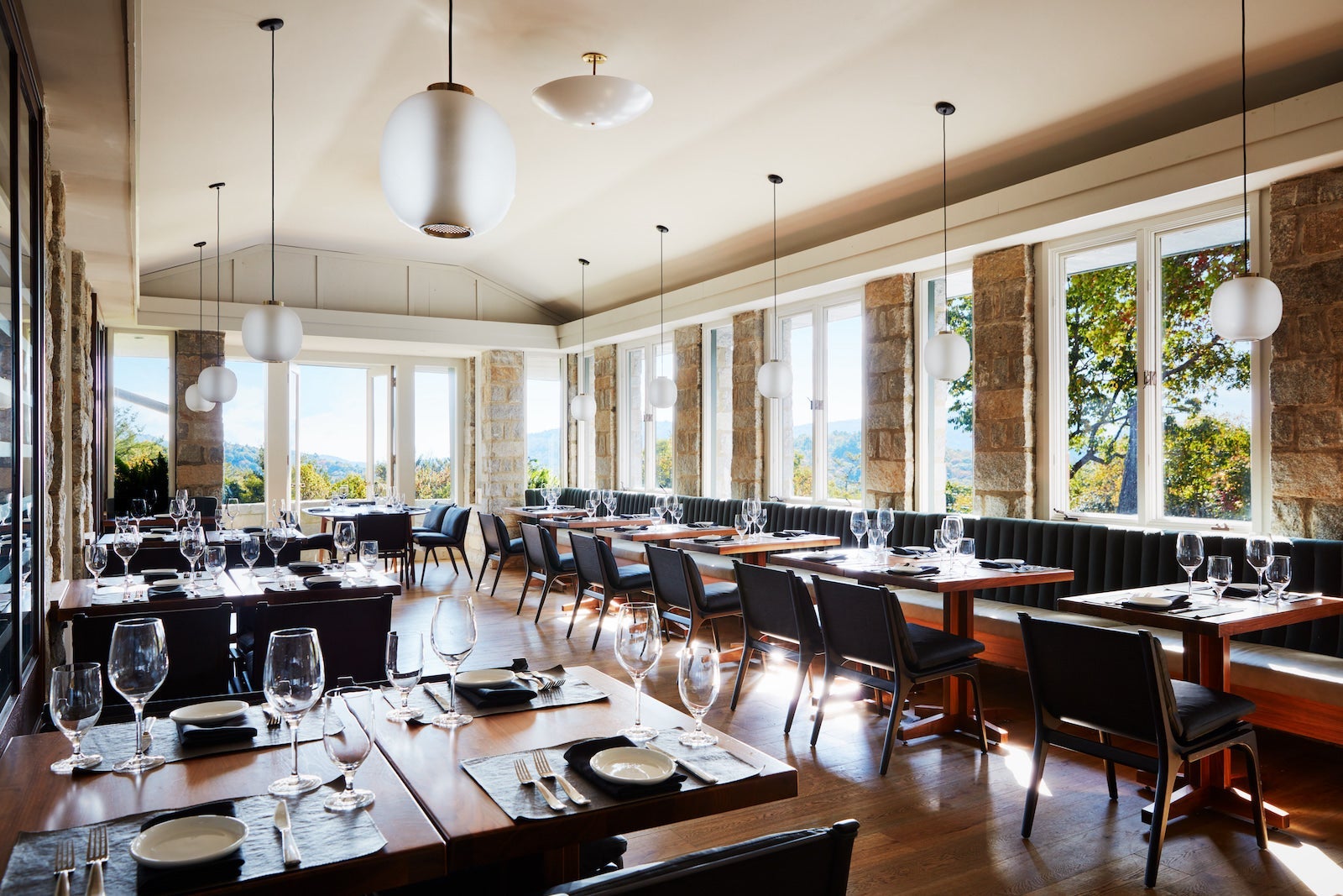 dining room with windows looking out to mountains