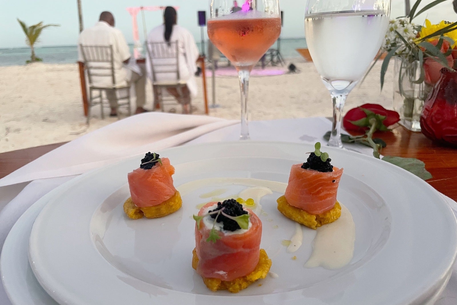 salmon and wine on beach