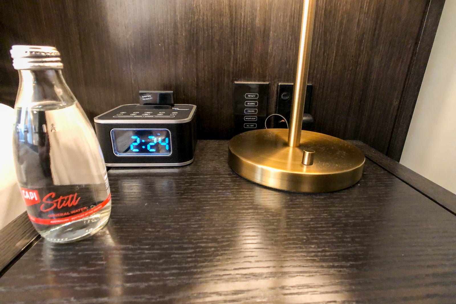 Hotel room table with clock.