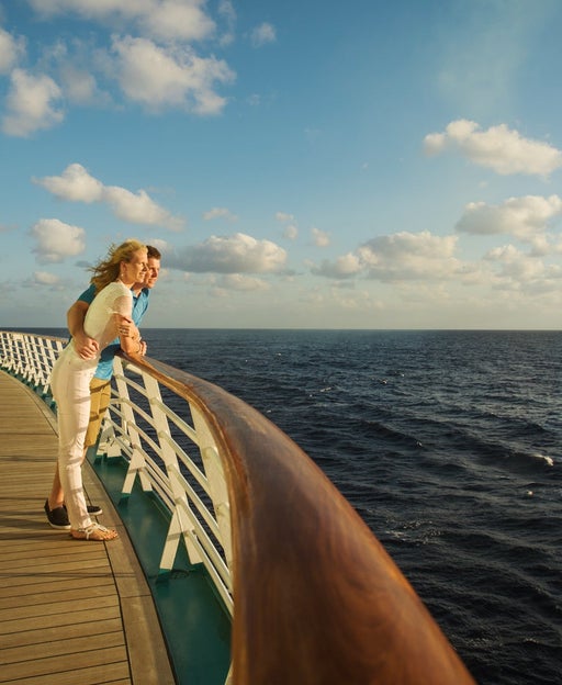 Caucasian couple admiring view from boat deck
