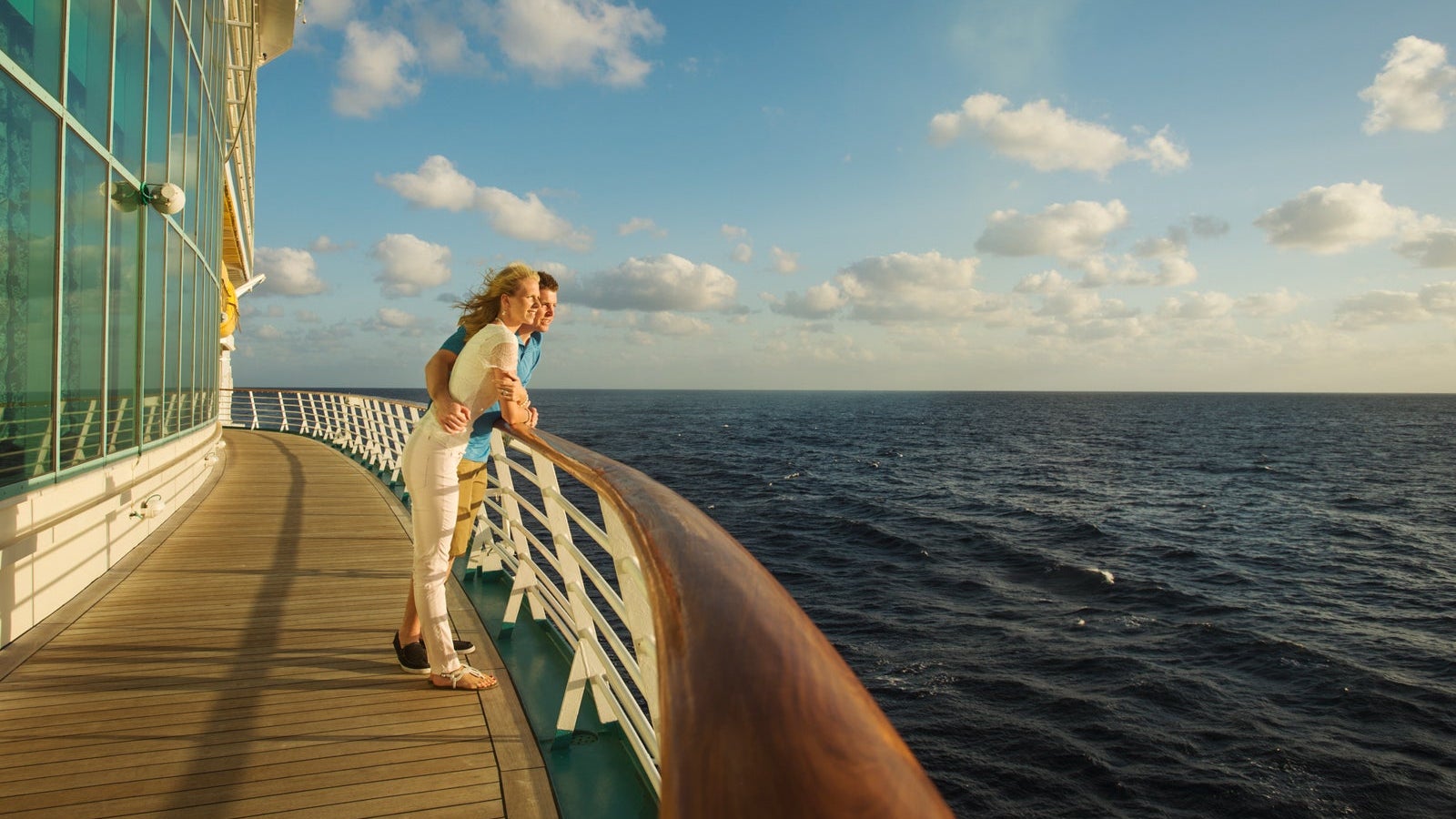 Caucasian couple admiring view from boat deck