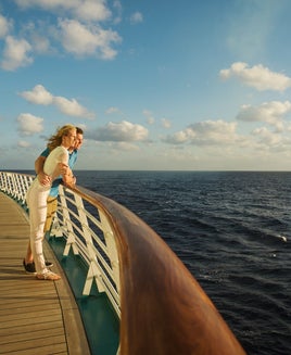 Caucasian couple admiring view from boat deck