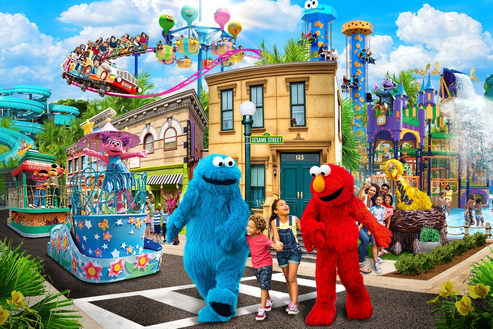 Cookie Monster and Elmo walking with children at Sesame Place San Diego