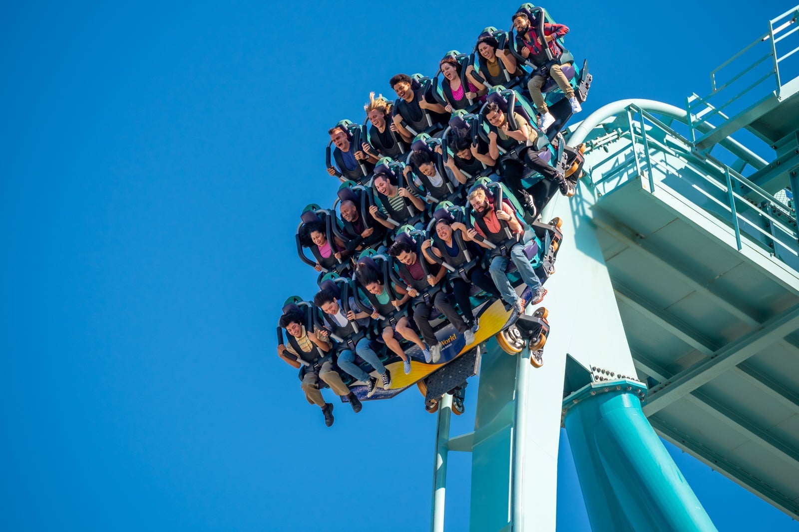 Riders on floorless dive coaster