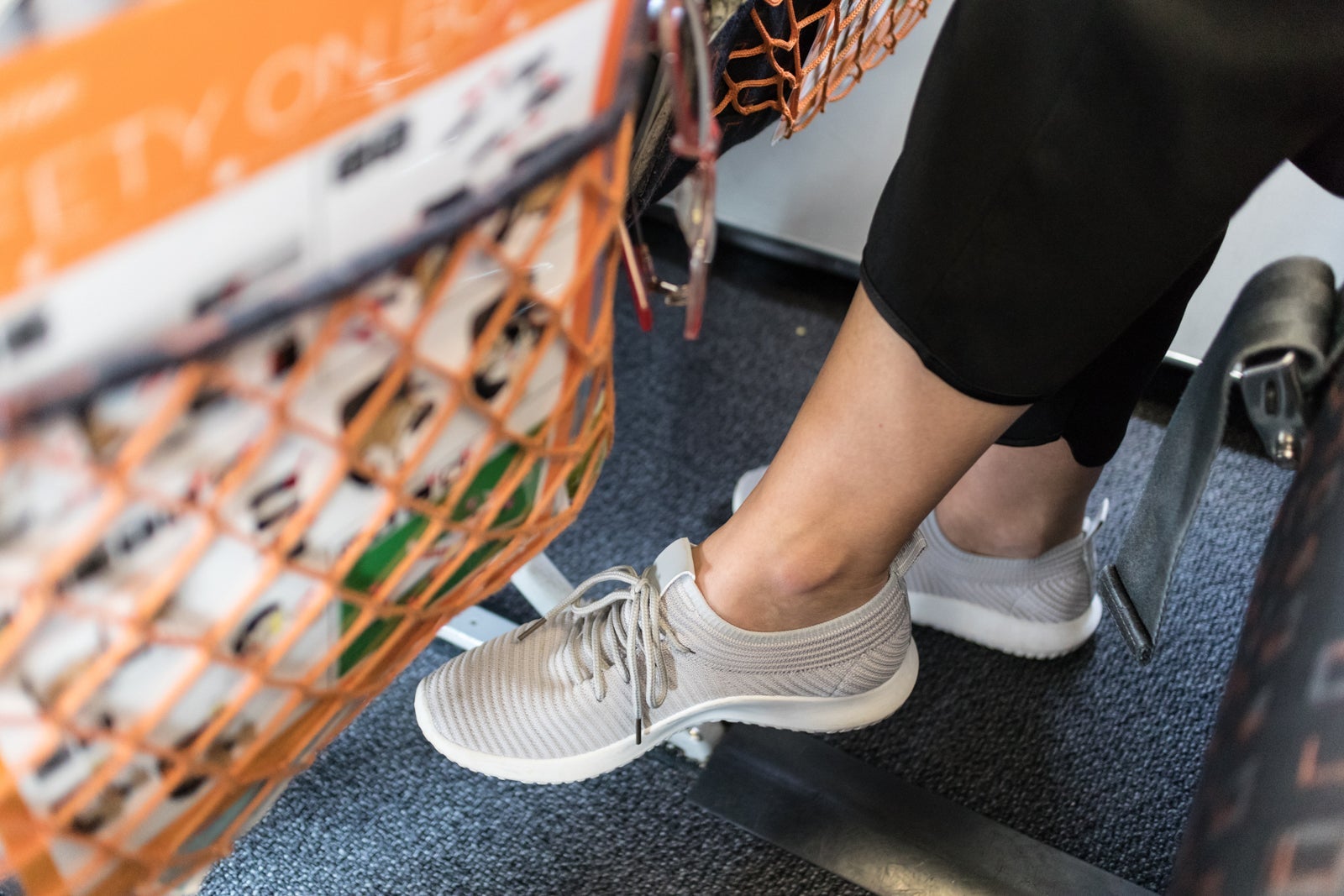 Female Passenger With Lack Of Leg Space On Long Commercial Airplane Flight