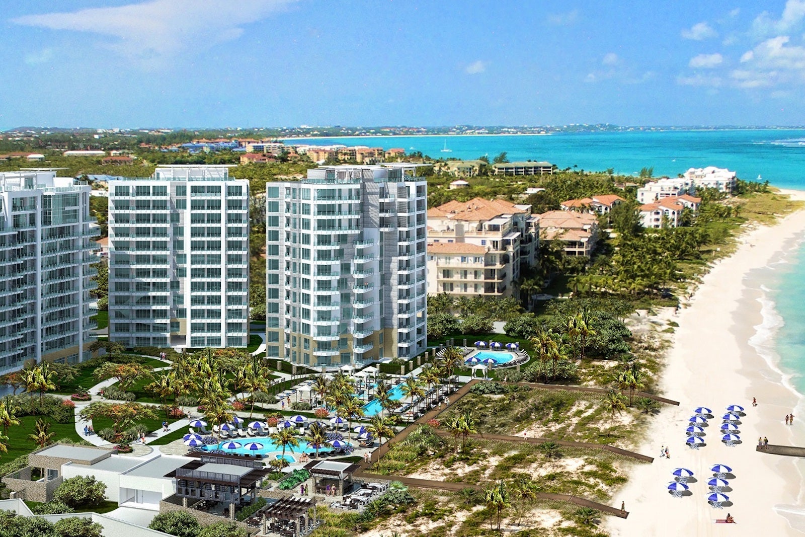 aerial photo of large resort towers by beach