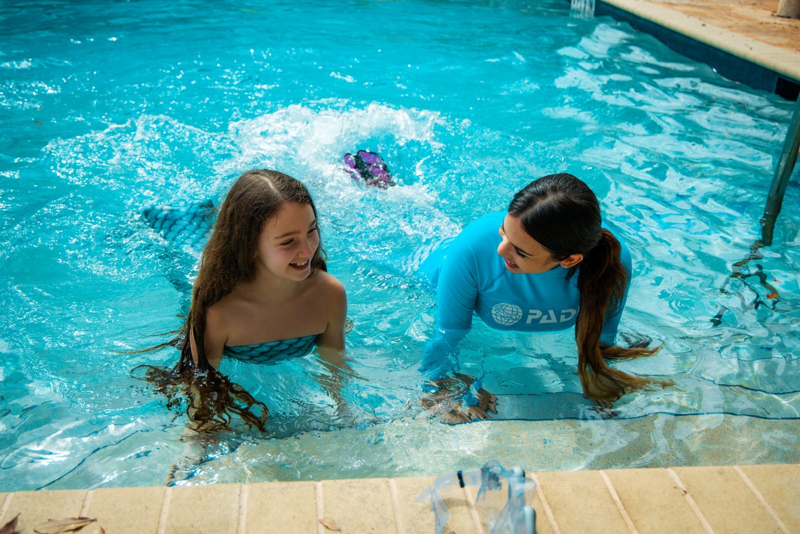 Child taking a mermaid class