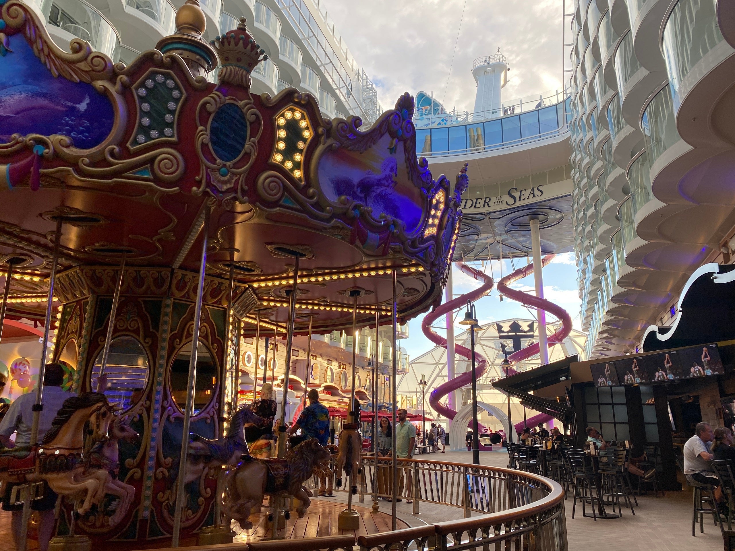 The carousel and dual Ultimate Abyss slides at The Boardwalk on Royal Caribbean's Wonder of the Seas