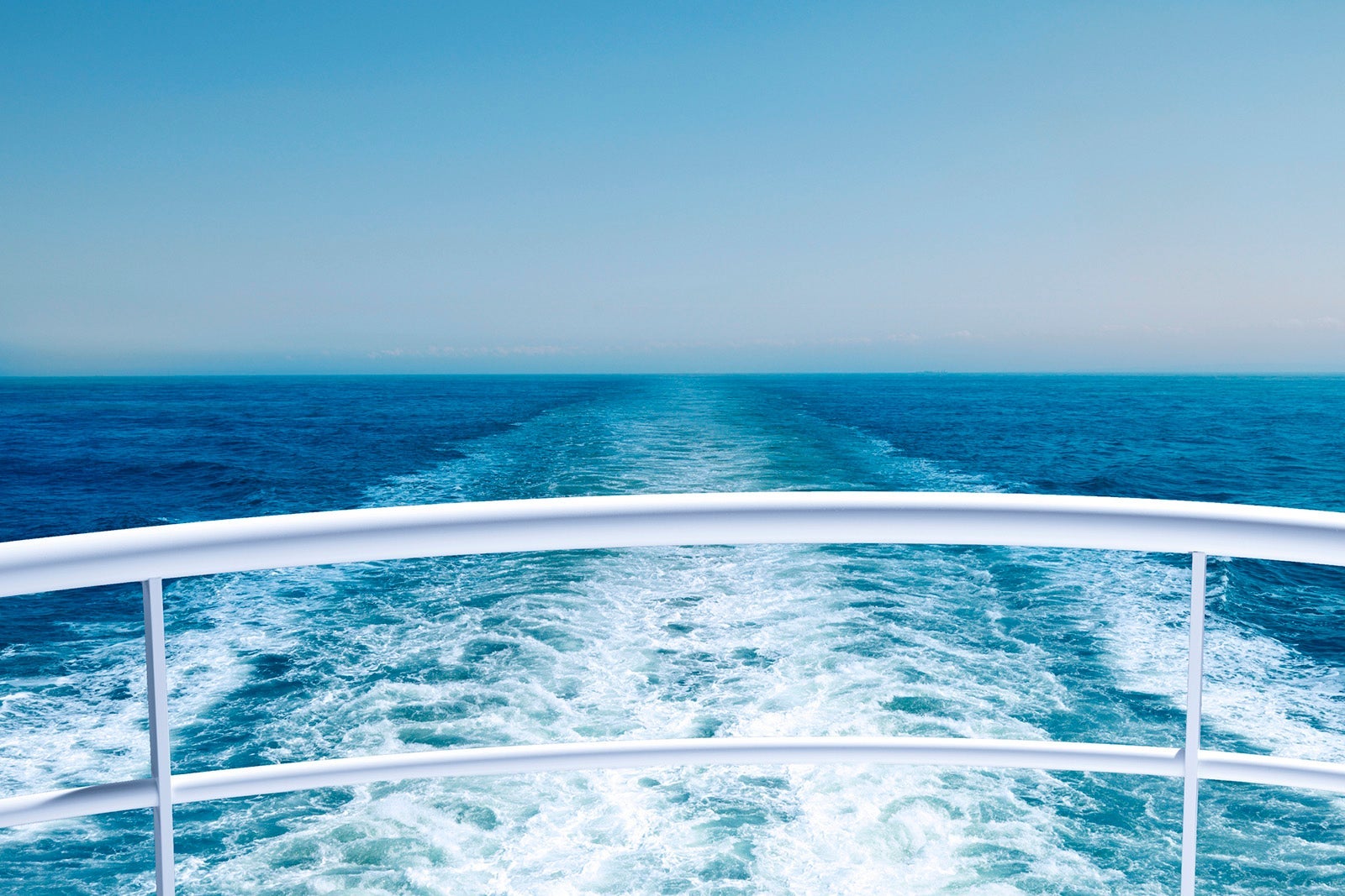 A wide shot of a cruise ship's wake
