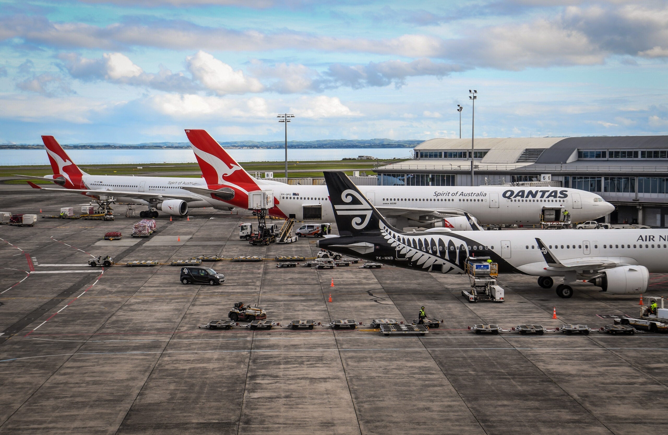 Qantas and Air New Zealand planes parked at the Auckland Airport
