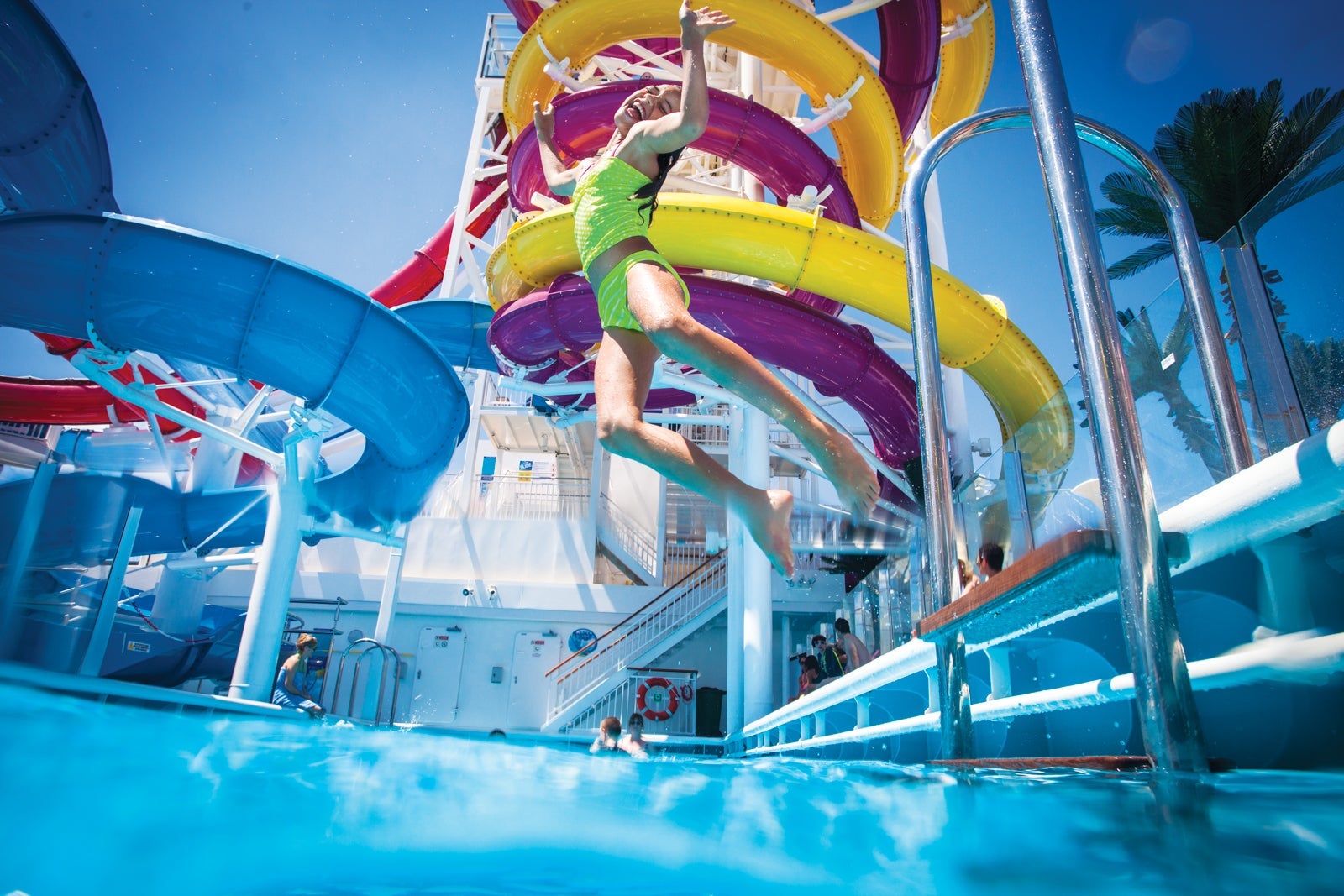 Girl jumping into pool on Norwegian Cruise Line ship