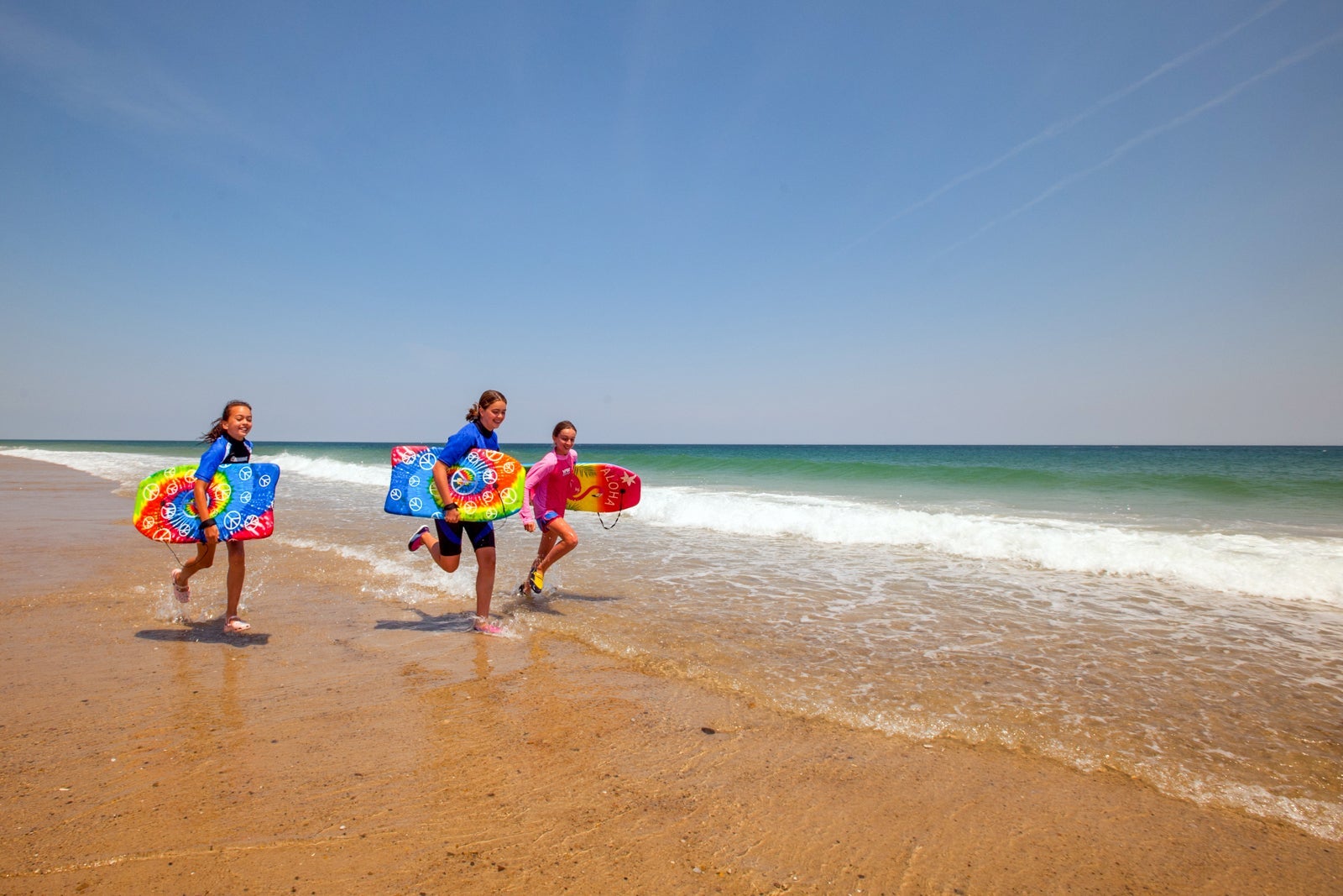 Kids running on beach