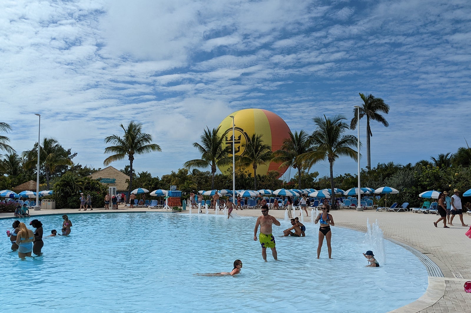 Large pool with colorful hot air balloon behind it