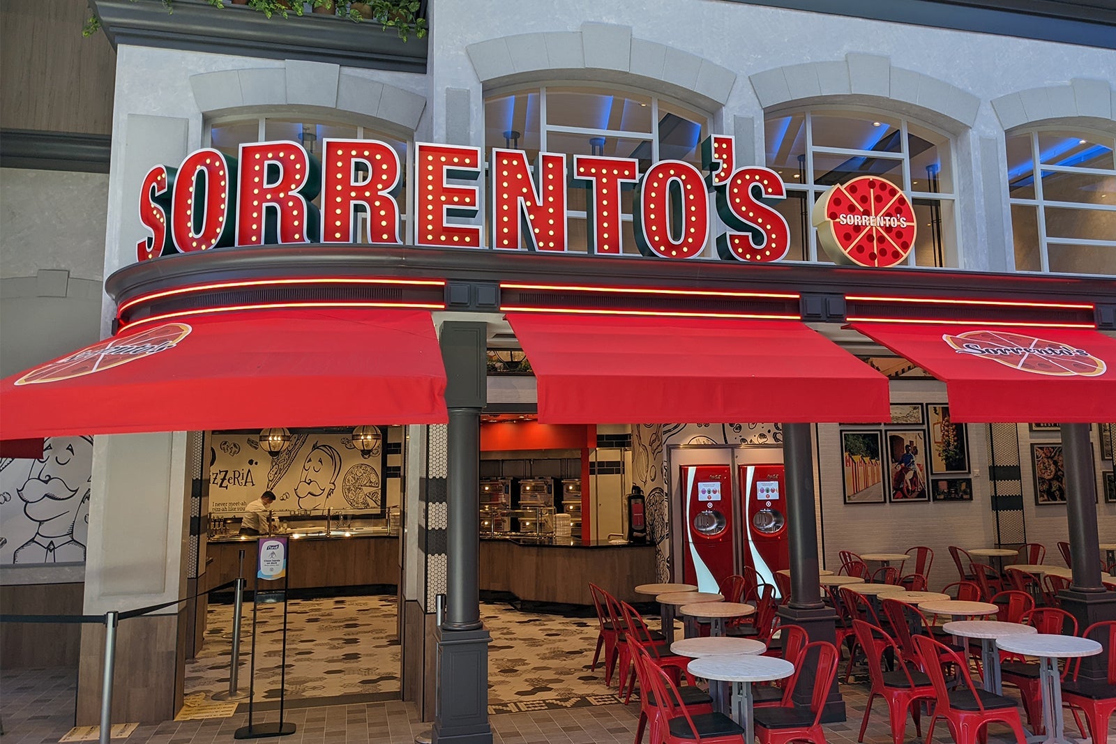 Pizzeria with red awnings, sign reads Sorrento's